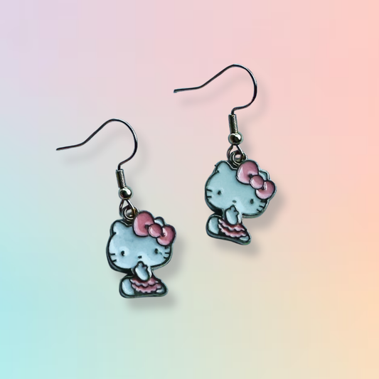 Hello Kitty earrings on Daisy Chikk pastel earring card with purple and blue ombré background – handmade Sanrio-style kawaii jewellery