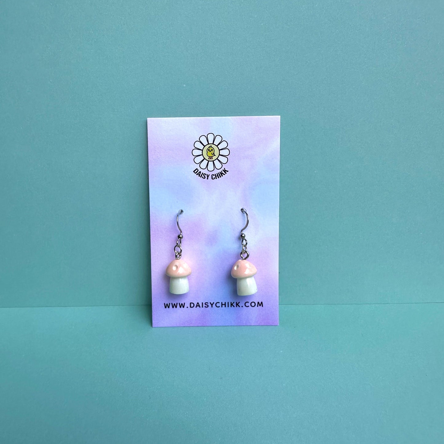 Light Pink mushroom earrings on pastel Daisy Chikk backing card – kawaii toadstool jewellery for cottagecore aesthetic