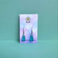 Blue gummy bear earrings on silver hooks displayed on a pastel Daisy Chikk backing card – handmade kawaii resin earrings