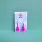 Hot pink gummy bear earrings on silver hooks displayed on a pastel Daisy Chikk backing card – handmade kawaii resin earrings