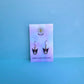 Kuromi earrings on Daisy Chikk pastel earring card with purple and blue ombré background – handmade Sanrio-style kawaii jewellery