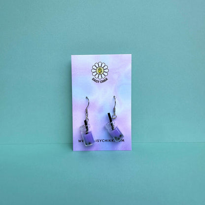 Purple boba tea earrings with silver hooks displayed on a pastel Daisy Chikk backing card – handmade kawaii bubble tea jewellery