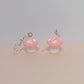 Light pink mushroom earrings with white stems and silver hooks on pastel background – kawaii fairycore handmade jewellery